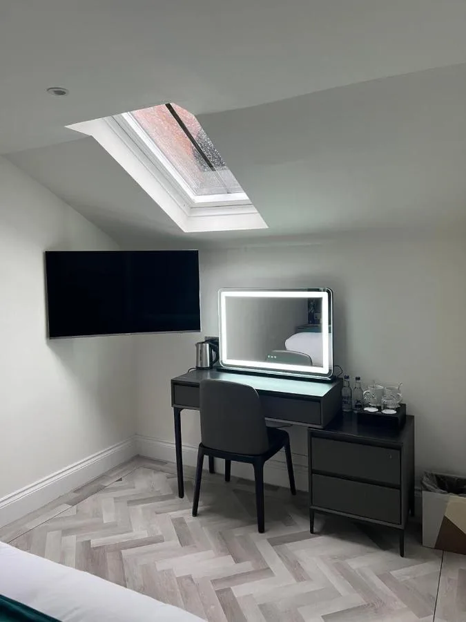 a room with a desk with a computer on it at Philharmonic Hotel in Liverpool